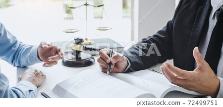 Consultation and conference of Male lawyers and professional businesswoman working and discussion having at law firm in office. Concepts of law, Judge gavel with scales of justice 72499751