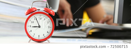 Exhausted young woman sleeping at the table at work Exhausted young woman sleeping at the table at work 72500715