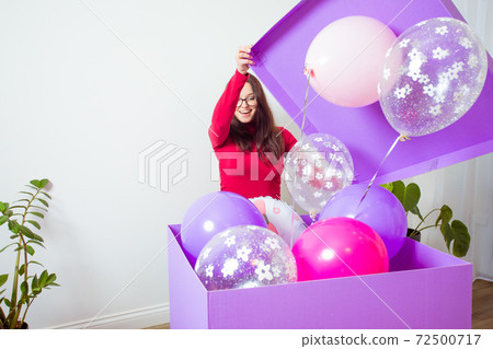 The girl rejoices in an unusual huge gift The girl rejoices in an unusual huge gift 72500717