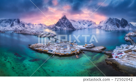 Aerial view of blue sea, snowy mountains, rocks, village Aerial view of blue sea, snowy mountains, rocks, village 72502042