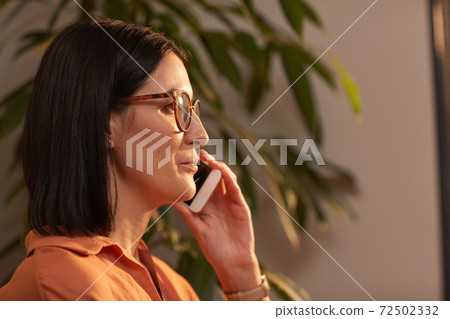 Contemporary Businesswoman Speaking by Smartphone Side View Contemporary Businesswoman Speaking by Smartphone Side View 72502332