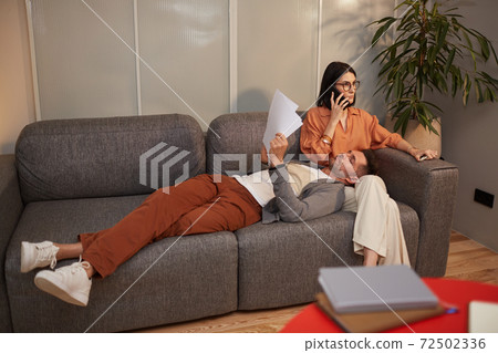 Contemporary Couple Working at Home 72502336