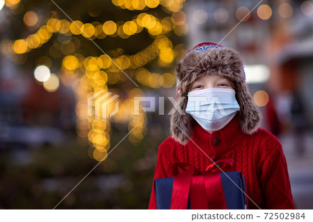 kid at christmas time during coronavirus pandemic 72502984