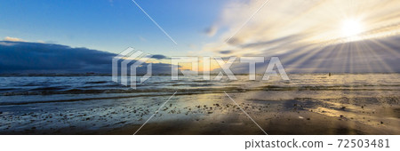Sunset on Crosby Beach in winter, Crosby, Liverpool, United Kingdom 72503481