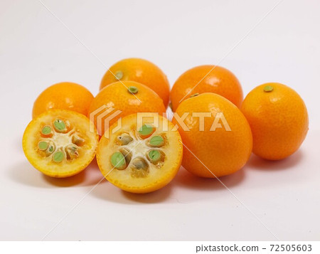 Ripe kumquat white background Ripe kumquat white background 72505603