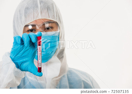 Medical scientist in PPE uniform wear a mask holding test tube Coronavirus 72507135