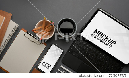 Workspace with tablet, keyboard, smartphone, stationery and supplies on the table Workspace with tablet, keyboard, smartphone, stationery and supplies on the table 72507785
