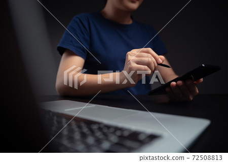 Hands using smart pen and working with laptop. Hands using smart pen and working with laptop. 72508813
