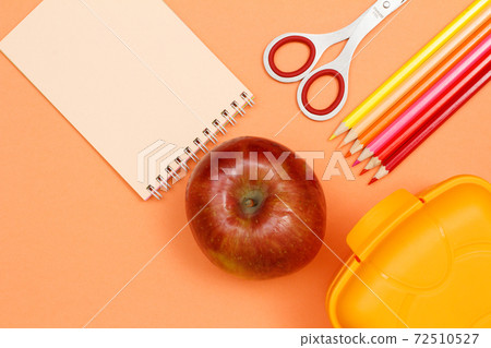 Notebook, apple, scissors, color pencils and lunch box. School supplies. Notebook, apple, scissors, color pencils and lunch box. School supplies. 72510527