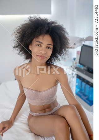 Young dark-haired woman in lingerie in cosmetology cabinet Young dark-haired woman in lingerie in cosmetology cabinet 72514462