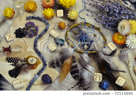 Still life with runes, decorated envelopes, dreamcatcher, lavender and ritual magic objects on witch table. Esoteric, gothic and occult background, Halloween mystic concept. Still life with runes, decorated envelopes, dreamcatcher, lavender and ritual magic objects on witch table. Esoteric, gothic and occult background, Halloween mystic concept. 72514890
