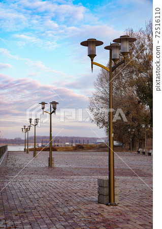 autumn embankment in city. walks by river. Cityscape. autumn embankment in city. walks by river. Cityscape. 72516110