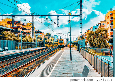 Suburban railway train at the railways stantion. 72517794