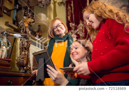 Cheerful family, mother and kids looking for home decoration and holiday's gifts in household store 72518989