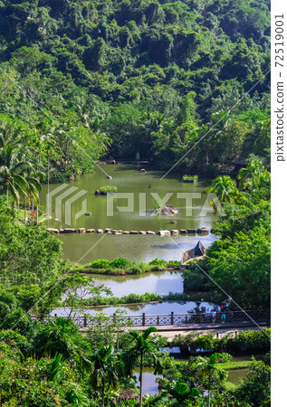 Colorful top view of park and lake in the Yanoda Rainforest Cultural Tourism Zone, Hainan 72519001