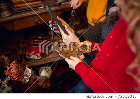 Cheerful family, mother and kids looking for home decoration and holiday's gifts in household store Cheerful family, mother and kids looking for home decoration and holiday's gifts in household store 72519013