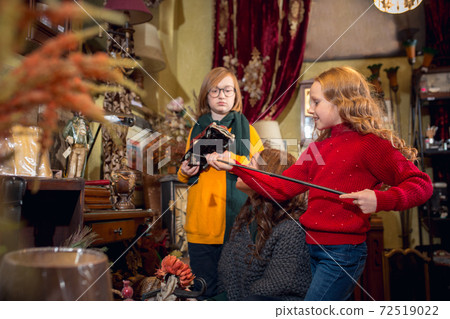 Cheerful family, mother and kids looking for home decoration and holiday's gifts in household store 72519022