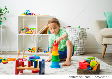 Child having good time at home or daycare. Child having good time at home or daycare. 72520332