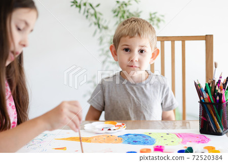 Cute toddler boy spending time with his sister 72520384