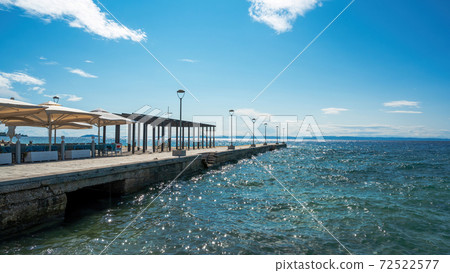 Pier with cafe in Nikiti, Greece Pier with cafe in Nikiti, Greece 72522577