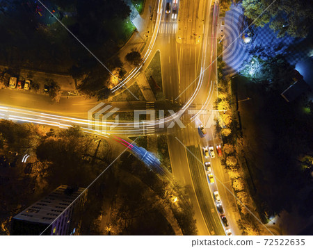 View of a crossroad at night in Bucharest, Romania View of a crossroad at night in Bucharest, Romania 72522635