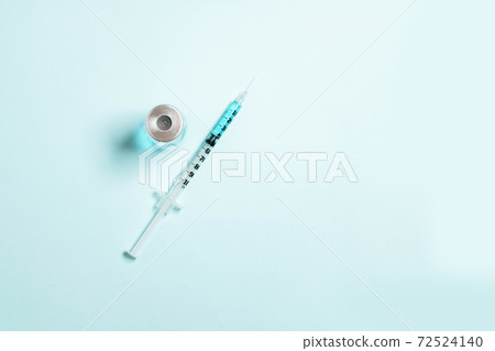Syringes with blue medicine liquid on an isolated blue solid background. Vaccination, immunity, cosmetology concept 72524140