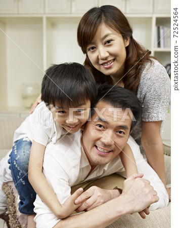 loving asian family having fun at home. loving asian family having fun at home. 72524564