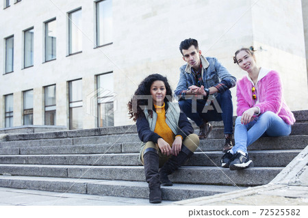 cute group of teenages at the building of university with books huggings, diversity nations real students lifestyle cute group of teenages at the building of university with books huggings, diversity nations real students lifestyle 72525582
