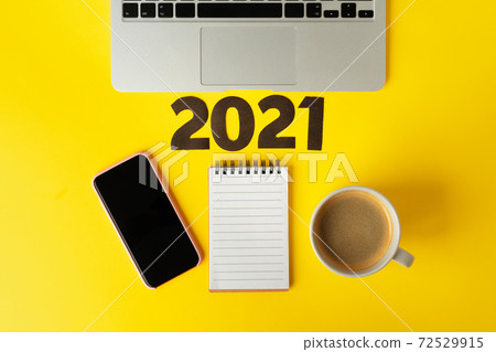 Office supplies and 2021 numbers. New year business goals and plans concept 72529915