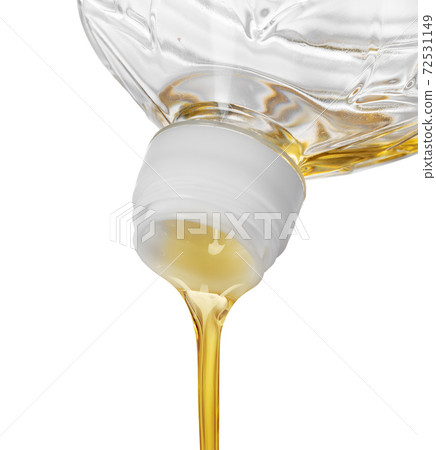 Pouring oil for cooking in a bottle isolated on white background. Pouring oil for cooking in a bottle isolated on white background. 72531149