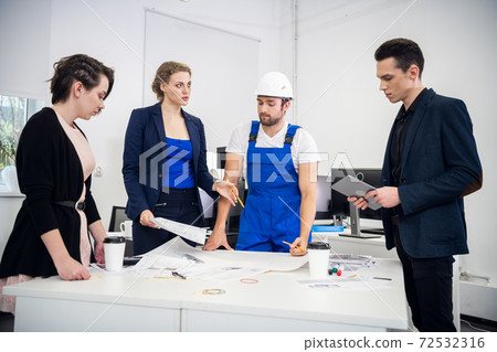 A Group Of Young Coworkers Making Great Business Decisions. Crea A Group Of Young Coworkers Making Great Business Decisions. Crea 72532316