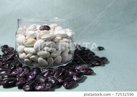 white beans in a glass jar and red blue on mint light background of a copy of the space white beans in a glass jar and red blue on mint light background of a copy of the space 72532590