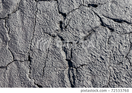Texture of wet cracked ground as background Texture of wet cracked ground as background 72533768