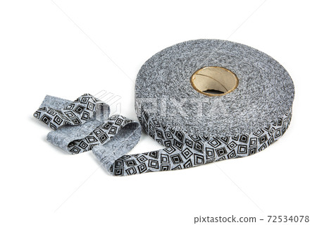 elastic knitted tape yarn for crochet on white background rolled up. elastic knitted tape yarn for crochet on white background rolled up. 72534078