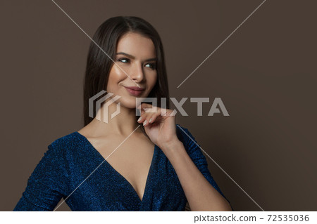 Beauty fashion portrait of attractive woman smiling on brown background 72535036