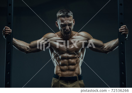 Energy caucasian strong athlete screaming in gym Energy caucasian strong athlete screaming in gym 72536266
