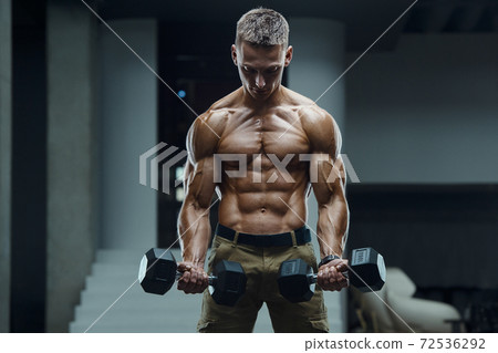 Caucasian man pumping up muscles. fitness training Caucasian man pumping up muscles. fitness training 72536292