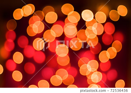 Abstract blurred bokeh lights on red background. Christmas and new year holidays light Abstract blurred bokeh lights on red background. Christmas and new year holidays light 72536436