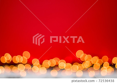 Abstract blurred bokeh lights on red background. Christmas and new year holidays light Abstract blurred bokeh lights on red background. Christmas and new year holidays light 72536438