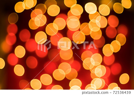 Abstract blurred bokeh lights on red background. Christmas and new year holidays light Abstract blurred bokeh lights on red background. Christmas and new year holidays light 72536439