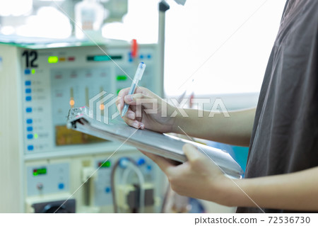 The specialist are checking continuous renal replacement therapy equipment and injection pump and hemodialysis machine. The specialist are checking continuous renal replacement therapy equipment and injection pump and hemodialysis machine. 72536730