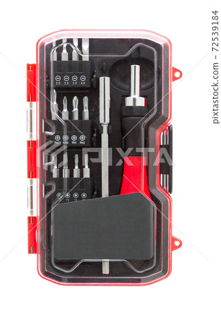 a set of working tools with a screwdriver and bits for repair in an label transparent plastic box with iron nozzles, an object isolated on a white background front view. 72539184