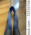 Legs sitting on the floor and stretching 72550708