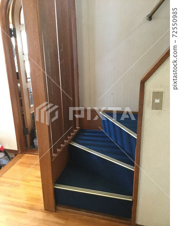 Retro carpeted curved stairs 72550985