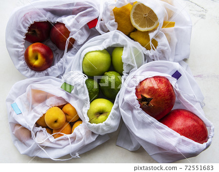Mesh shopping bags with organic fruits Mesh shopping bags with organic fruits 72551683