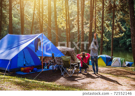 Asian woman travel nature camping on the Mountain see the lake in the mist at morning sunrise at Pang Ung , Mae Hong Son province, Thailand. Asian woman travel nature camping on the Mountain see the lake in the mist at morning sunrise at Pang Ung , Mae Hong Son province, Thailand. 72552146