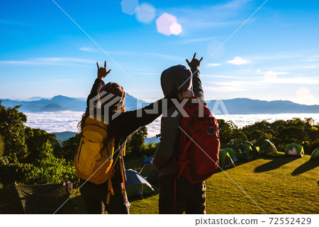 Young couple Camping Hiking Journey Travel Trek Concept, Holiday travel, Travel relax, Natural Touch countryside, in Thailand. Young couple Camping Hiking Journey Travel Trek Concept, Holiday travel, Travel relax, Natural Touch countryside, in Thailand. 72552429