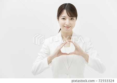 Business woman doing "OK sign" Business woman doing "OK sign" 72553324