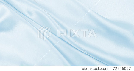 Smooth elegant blue silk or satin luxury cloth texture as abstract background. Luxurious background design Smooth elegant blue silk or satin luxury cloth texture as abstract background. Luxurious background design 72556097