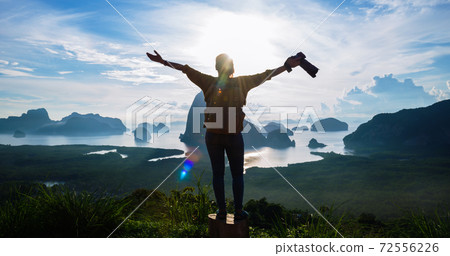 Female tourist photographers travel on the mountain. Landscape Beautiful Mountain on sea at Samet Nangshe Viewpoint. Phang Nga Bay ,Travel adventure, Travel Thailand, Tourist on summer holiday Female tourist photographers travel on the mountain. Landscape Beautiful Mountain on sea at Samet Nangshe Viewpoint. Phang Nga Bay ,Travel adventure, Travel Thailand, Tourist on summer holiday 72556226